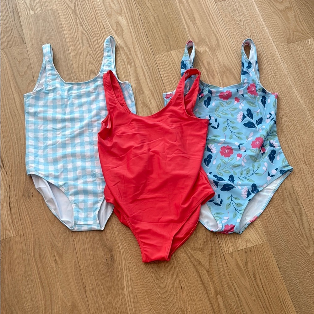 Set of Three Girls XL NWOT One-Piece Swimsuits in Red and Blue Patterns